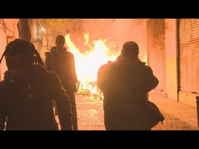 Migrantupplopp i Madrid – attackerade polis