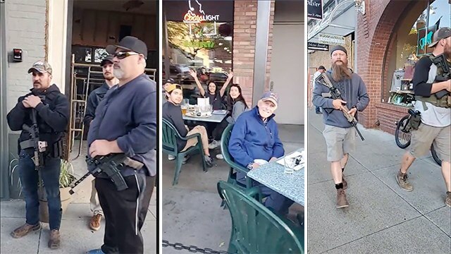 Här patrullerar amerikaner med automatvapen för att skydda sig mot upploppsmakarna